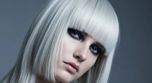 Icy blonde wolf cut with blunt bangs for sharp modern hairstyle