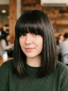 Thick full bangs hairstyle