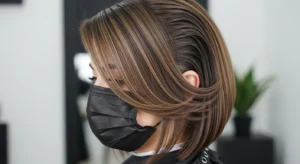 Sleek wolf cut without bangs with polished smooth layers