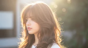 Long wavy wolf cut with feathered bangs and soft layers