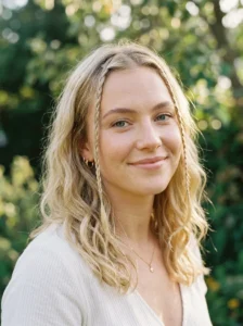 Face framing baby braids on blonde hair with soft waves
