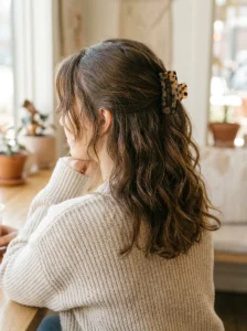 Half up claw clip hairstyle for greasy hair