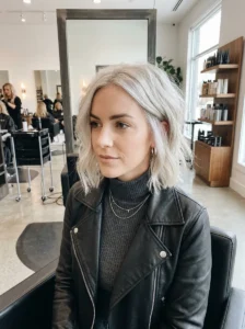 Ice blonde wavy bob haircut with textured platinum blonde waves