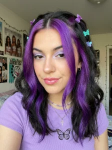 Chunky purple face framing highlights Y2K hairstyle