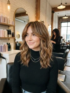 Woman with trendy medium shag haircut and curtain bangs