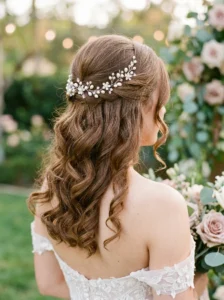 Half up half down bridal hairstyle with soft curls