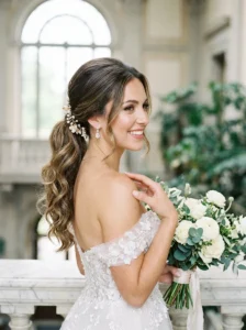 Elegant bridal ponytail with curled ends