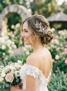Romantic bridal updo with soft curled details