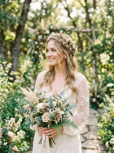 Bridal crown braid hairstyle with floral accents