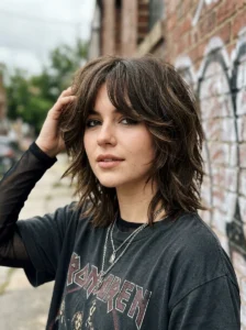 Soft curtain fringe shag haircut with modern emo styling