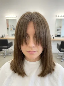 Curtain bangs growing into face framing layers