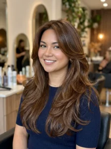 Long layered hairstyle that adds length to a round face shape