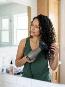 Styling routine for maintaining layered curly hair