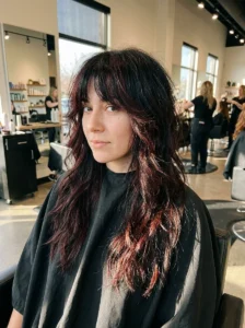 Black wolf cut with subtle burgundy undertones and layered texture