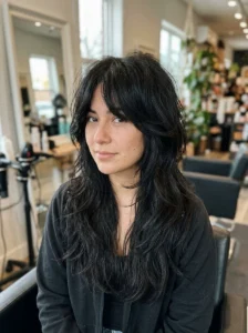 Soft black wolf cut with natural shine and feathered layers