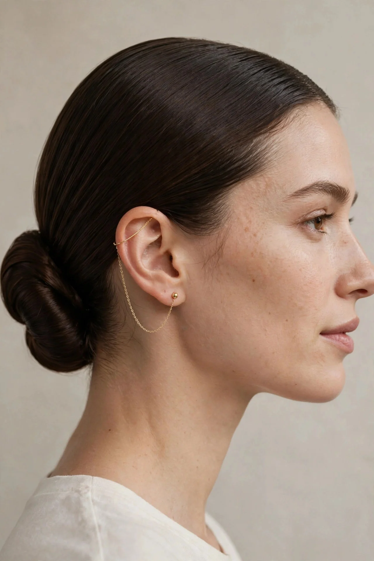 Earring Chain With a Sleek Low Bun hair