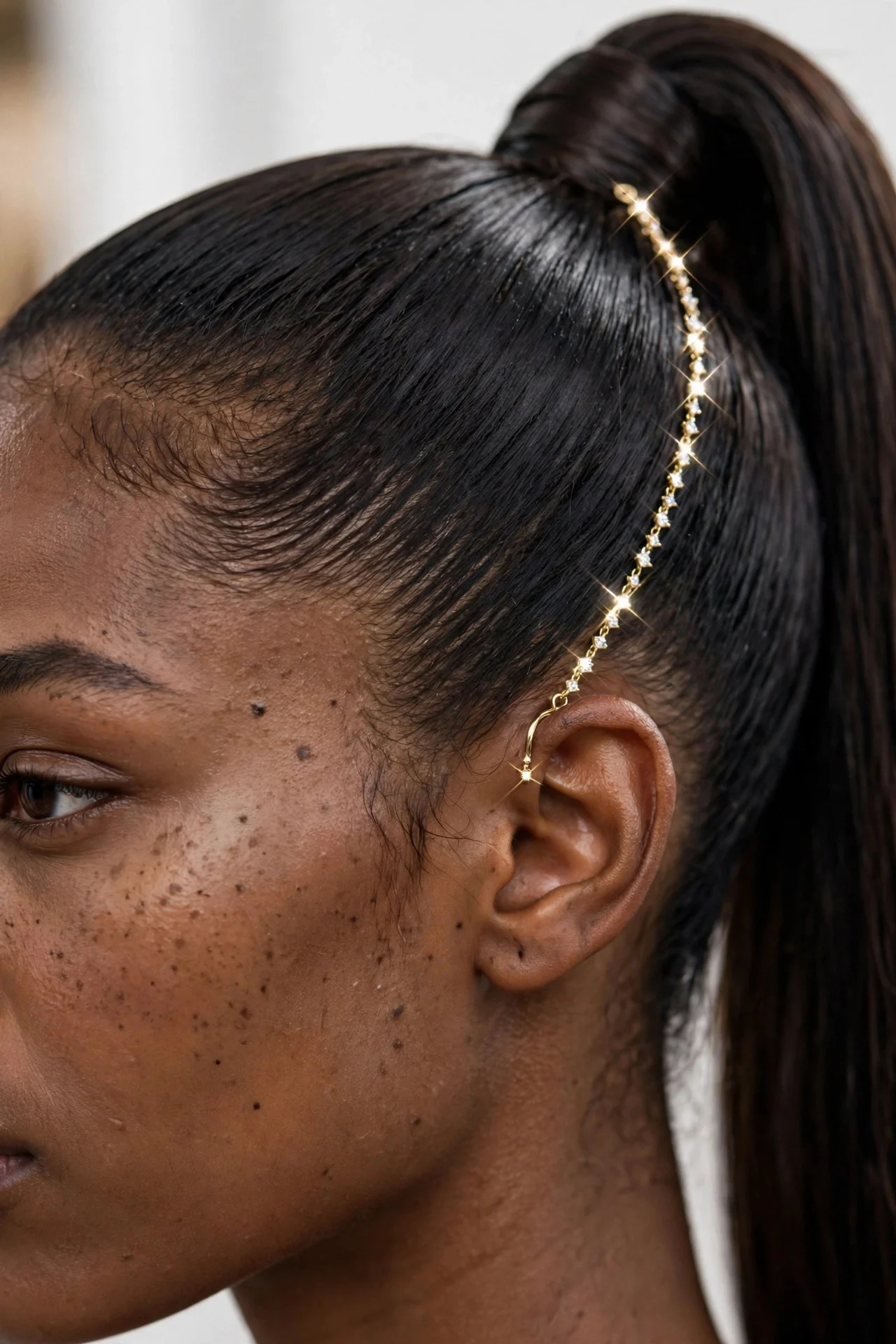 Earring Chain With a High Sleek Ponytail hair